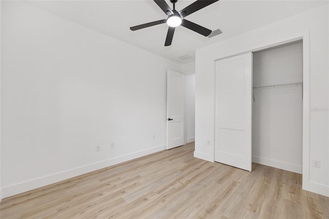 8200 SW 125th Court Rd, Dunnellon, FL 34432 - unfurnished bedroom featuring wood finished floors, baseboards, a closet, and ceiling fan