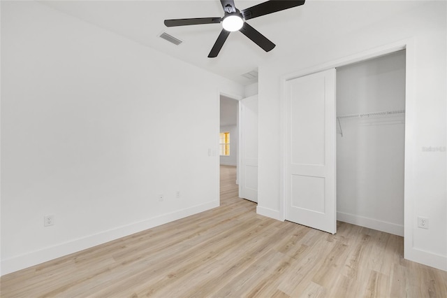 8200 SW 125th Court Rd, Dunnellon, FL 34432 - unfurnished bedroom with wood finished floors, baseboards, a closet, and ceiling fan