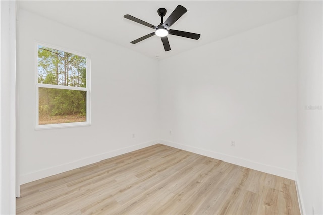 8200 SW 125th Court Rd, Dunnellon, FL 34432 - empty room featuring wood finished floors, baseboards, and a ceiling fan