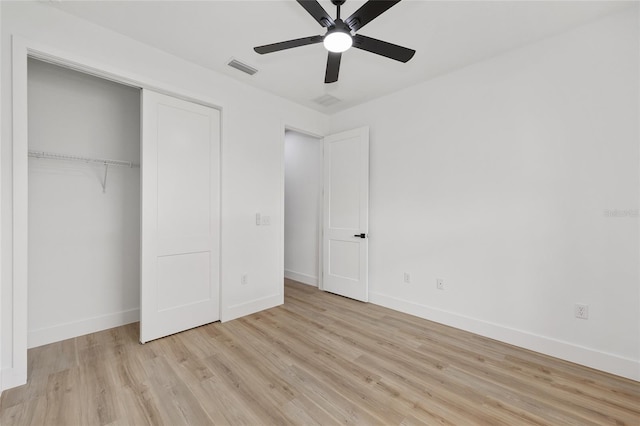 8200 SW 125th Court Rd, Dunnellon, FL 34432 - unfurnished bedroom featuring wood finished floors, baseboards, a closet, and a ceiling fan