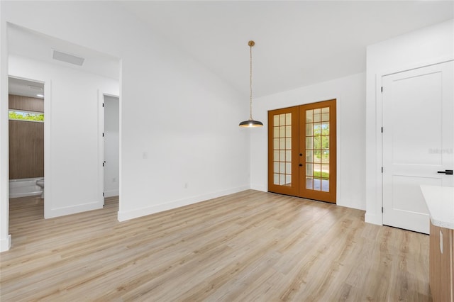 8200 SW 125th Court Rd, Dunnellon, FL 34432 - interior space with french doors, light wood-style floors, healthy amount of natural light, baseboards, and vaulted ceiling