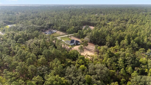 8200 SW 125th Court Rd, Dunnellon, FL 34432 - aerial view of property and surrounding area featuring a heavily wooded area