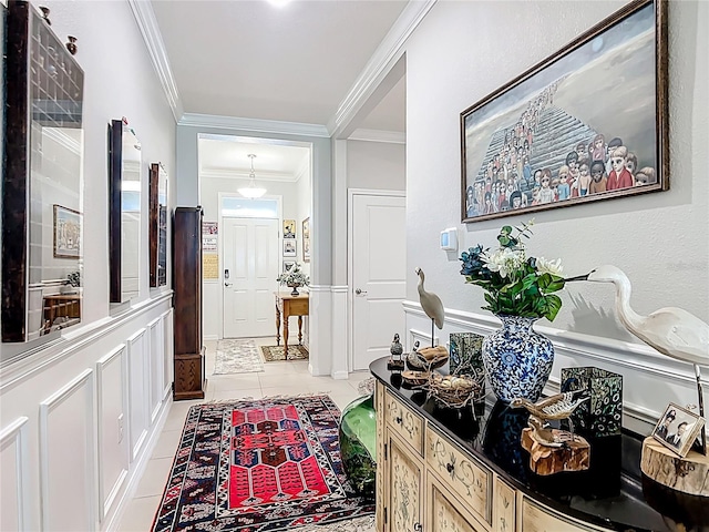 9237 SW 60th Terrace Rd, Ocala, FL 34476 - corridor featuring light tile patterned floors, crown molding, a wainscoted wall, and a decorative wall