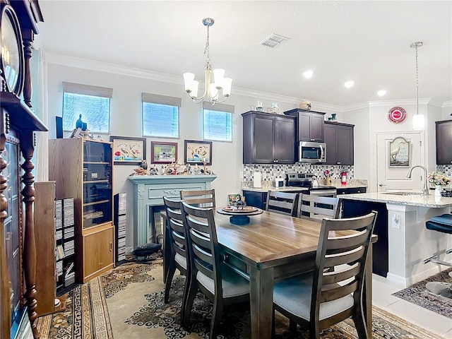 9237 SW 60th Terrace Rd, Ocala, FL 34476 - dining space with crown molding, a chandelier, recessed lighting, and light tile patterned floors