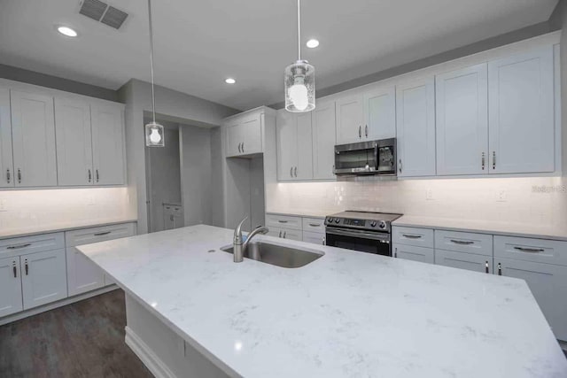 5830 SW 121st Ter, Ocala, FL 34481 - kitchen with appliances with stainless steel finishes, a sink, backsplash, white cabinetry, and recessed lighting