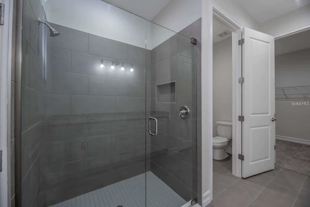 5830 SW 121st Ter, Ocala, FL 34481 - bathroom with toilet, a stall shower, and tile patterned flooring