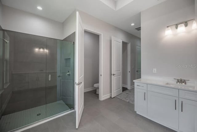 2050 NW 79th Loop, Ocala, FL 34475 - full bathroom featuring vanity, a shower stall, toilet, recessed lighting, and baseboards