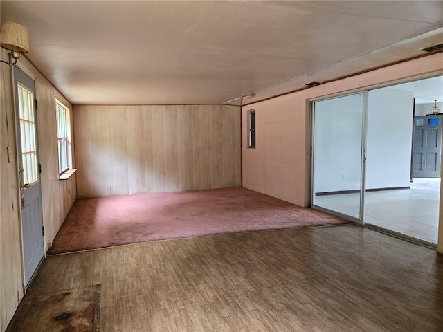 9330 N Citrus Springs Blvd, Citrus Springs, FL 34434 - spare room featuring wood finished floors and wooden walls