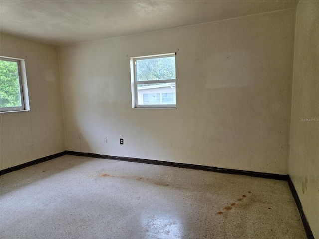 9330 N Citrus Springs Blvd, Citrus Springs, FL 34434 - spare room featuring healthy amount of natural light and baseboards