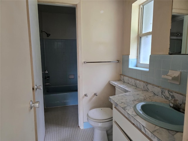 9330 N Citrus Springs Blvd, Citrus Springs, FL 34434 - full bath with vanity, toilet, bathing tub / shower combination, tile patterned flooring, and decorative backsplash