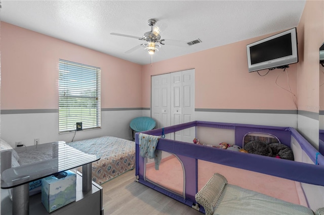 2698 SW 186th Ct, Dunnellon, FL 34432 - bedroom featuring a closet, wood finished floors, and ceiling fan