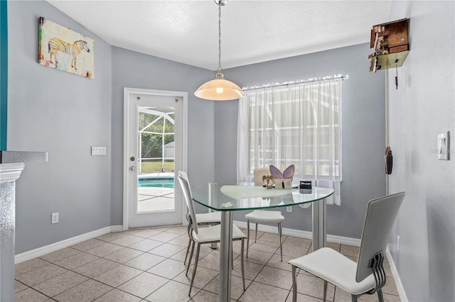 2698 SW 186th Ct, Dunnellon, FL 34432 - dining area with light tile patterned floors and a textured ceiling