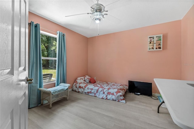 2698 SW 186th Ct, Dunnellon, FL 34432 - bedroom with wood finished floors and a ceiling fan