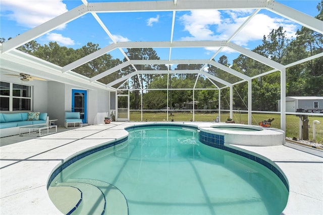 2698 SW 186th Ct, Dunnellon, FL 34432 - view of swimming pool featuring a patio, a pool with connected hot tub, ceiling fan, a yard, and an outbuilding