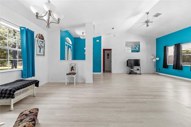 2698 SW 186th Ct, Dunnellon, FL 34432 - living area with wood finished floors, lofted ceiling, a chandelier, and a ceiling fan