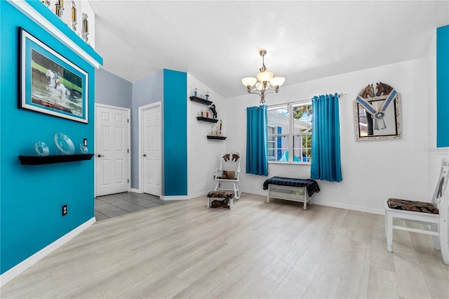 2698 SW 186th Ct, Dunnellon, FL 34432 - living area with a chandelier, wood finished floors, and a textured ceiling