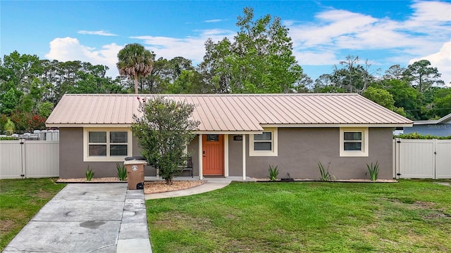 1520 NE 17th Ave, Ocala, FL 34470 - single story home featuring a gate, stucco siding, and metal roof