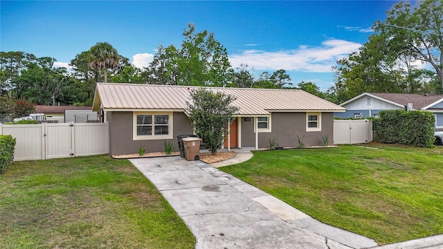 1520 NE 17th Ave, Ocala, FL 34470 - ranch-style house featuring a gate, stucco siding, metal roof, and concrete driveway