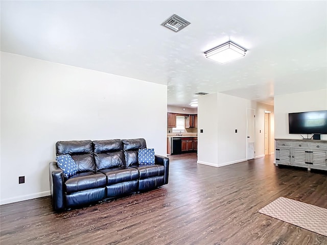 1520 NE 17th Ave, Ocala, FL 34470 - living room featuring dark wood-style flooring and baseboards