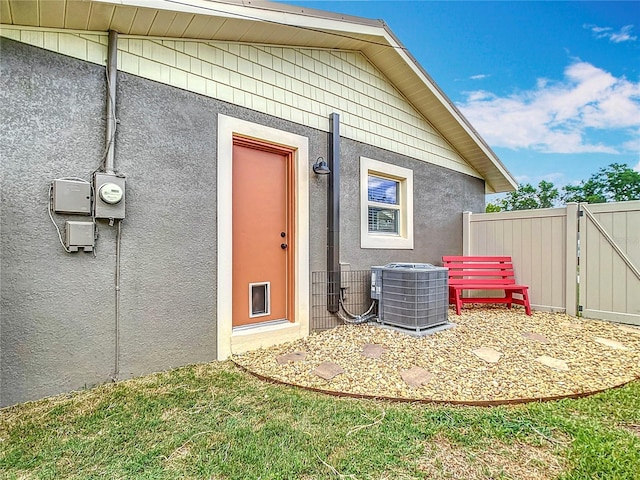 1520 NE 17th Ave, Ocala, FL 34470 - property entrance featuring central AC and stucco siding