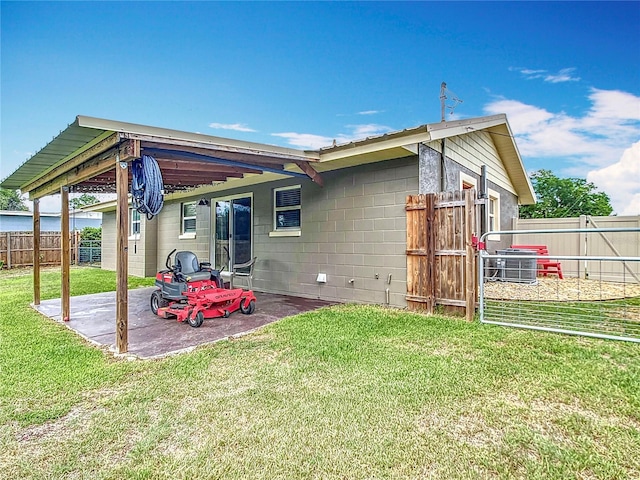 1520 NE 17th Ave, Ocala, FL 34470 - rear view of property featuring a patio area and concrete block siding