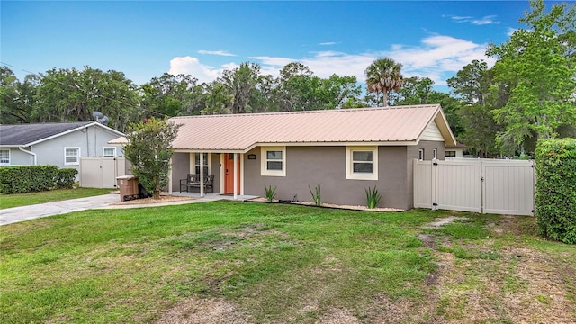 1520 NE 17th Ave, Ocala, FL 34470 - single story home featuring a gate, stucco siding, metal roof, and covered porch