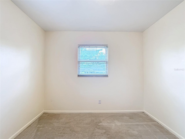 1520 NE 17th Ave, Ocala, FL 34470 - empty room with baseboards and light carpet