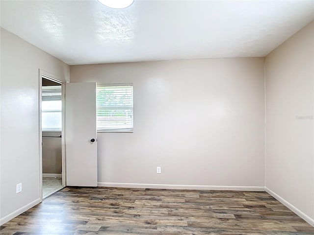 1520 NE 17th Ave, Ocala, FL 34470 - spare room with wood finished floors and baseboards
