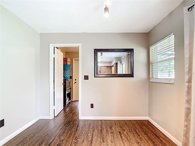 1520 NE 17th Ave, Ocala, FL 34470 - empty room featuring wood finished floors and baseboards