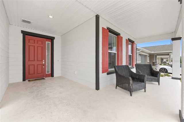 6486 SW 75th Avenue Rd, Ocala, FL 34474 - doorway to property featuring covered porch