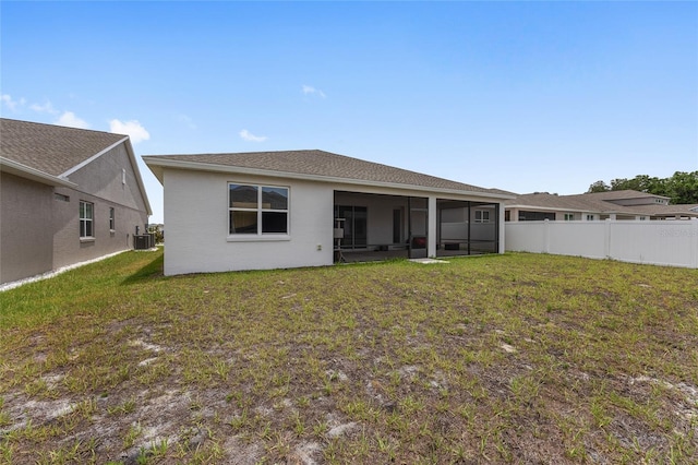 6486 SW 75th Avenue Rd, Ocala, FL 34474 - back of house with cooling unit, a sunroom, and stucco siding