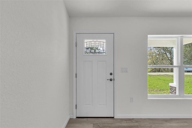 5709 NW 6th Pl, Ocala, FL 34482 - foyer with baseboards and wood finished floors