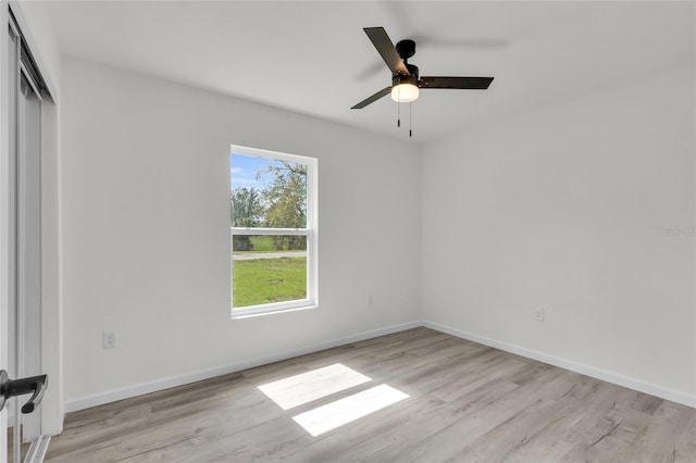 5709 NW 6th Pl, Ocala, FL 34482 - unfurnished room featuring light wood-type flooring, baseboards, and a ceiling fan