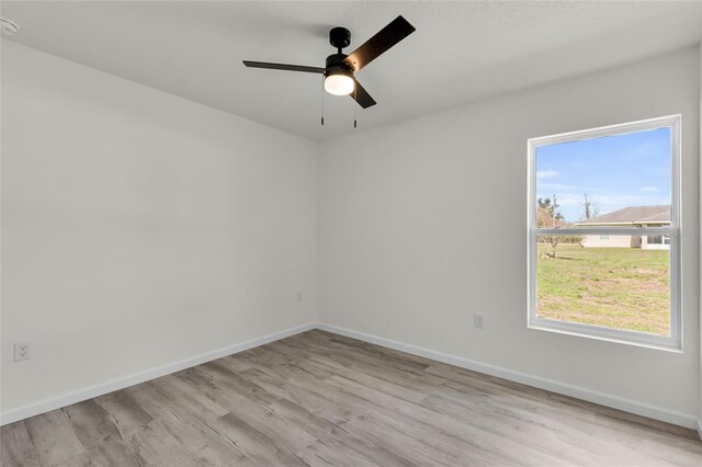 5709 NW 6th Pl, Ocala, FL 34482 - spare room featuring light wood-style flooring, baseboards, and ceiling fan