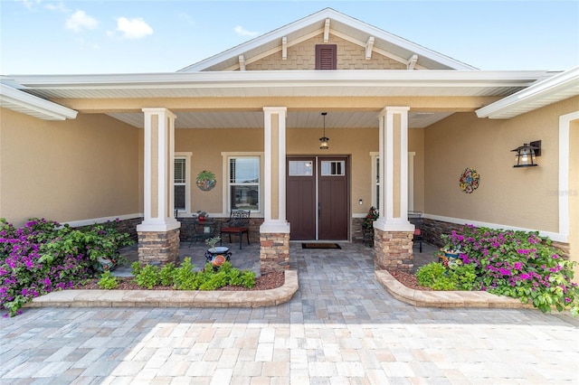 9607 SW 79th Lane Rd, Ocala, FL 34481 - property entrance with stucco siding and a porch