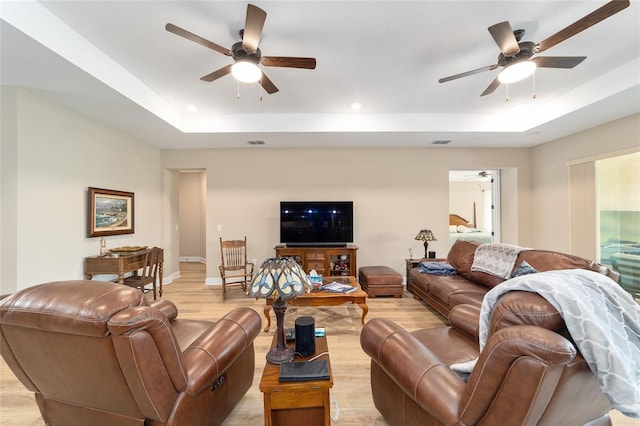9607 SW 79th Lane Rd, Ocala, FL 34481 - living room featuring ceiling fan, a tray ceiling, light wood-type flooring, and recessed lighting