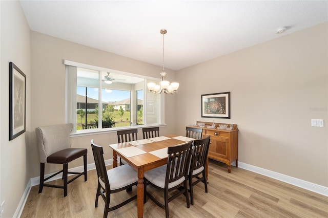 9607 SW 79th Lane Rd, Ocala, FL 34481 - dining area featuring light wood-style flooring, baseboards, and a chandelier