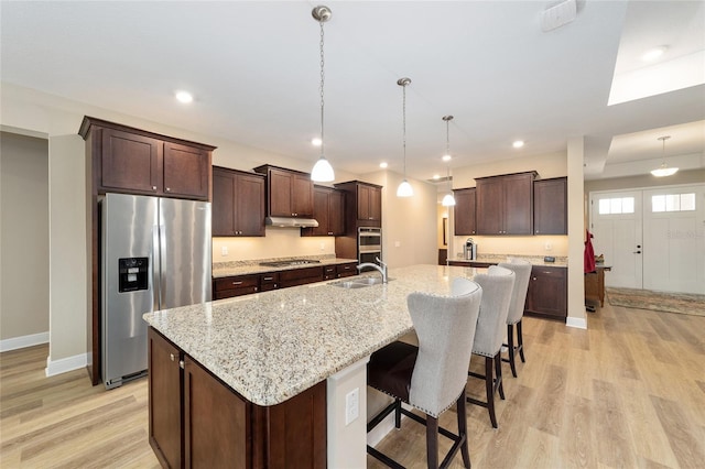 9607 SW 79th Lane Rd, Ocala, FL 34481 - kitchen with appliances with stainless steel finishes, a sink, light wood-style flooring, dark brown cabinets, and recessed lighting