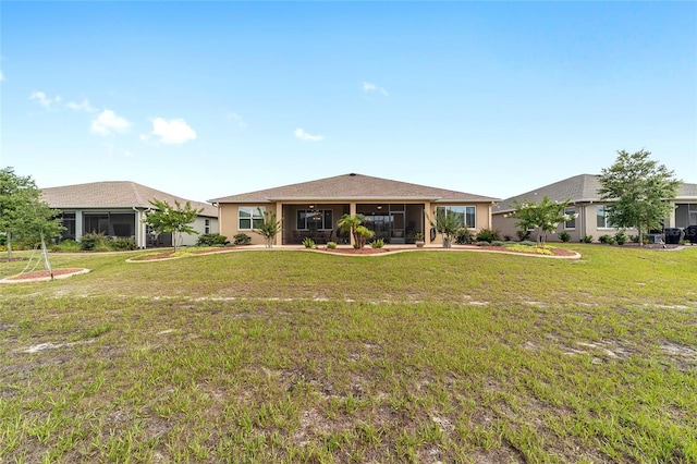 9607 SW 79th Lane Rd, Ocala, FL 34481 - back of property featuring ceiling fan, a yard, and a sunroom