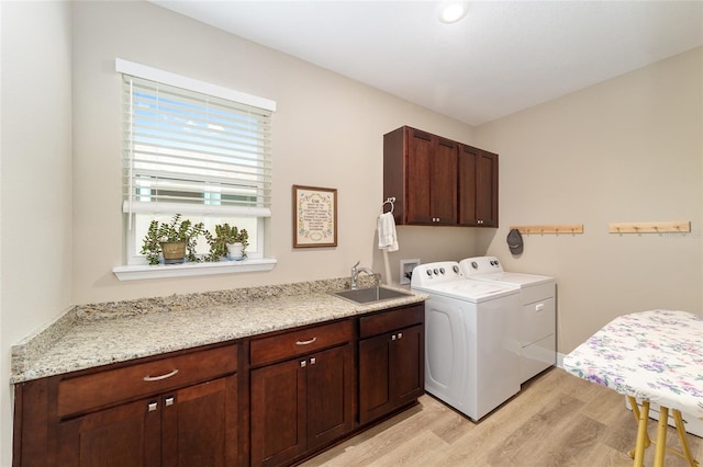 9607 SW 79th Lane Rd, Ocala, FL 34481 - washroom featuring cabinet space, light wood-style flooring, and washer and dryer