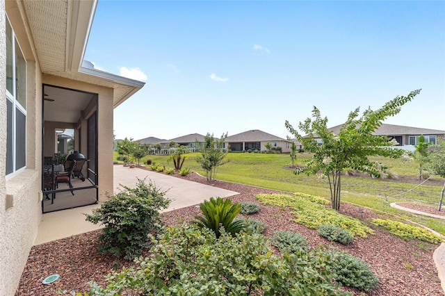 9607 SW 79th Lane Rd, Ocala, FL 34481 - view of green lawn featuring a patio area and a residential view