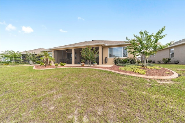 9607 SW 79th Lane Rd, Ocala, FL 34481 - rear view of house featuring a sunroom and a yard