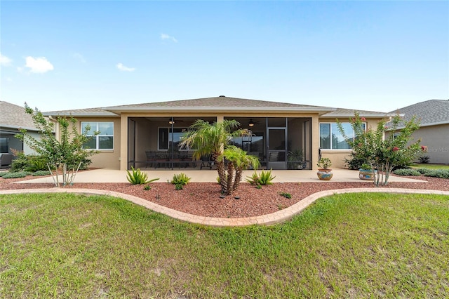 9607 SW 79th Lane Rd, Ocala, FL 34481 - back of property featuring a sunroom, a yard, a ceiling fan, and stucco siding