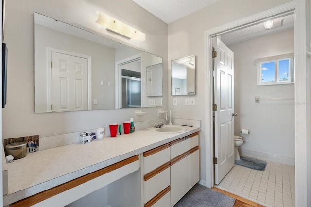 17890 SE 96th Ct, Summerfield, FL 34491 - bathroom featuring toilet, vanity, a shower stall, and tile patterned floors