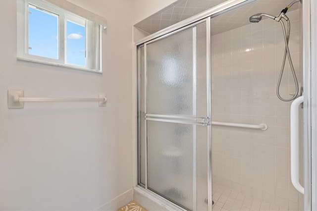 17890 SE 96th Ct, Summerfield, FL 34491 - bathroom featuring a shower stall and baseboards