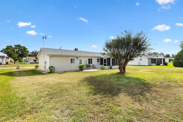 17890 SE 96th Ct, Summerfield, FL 34491 - back of house featuring a patio area and a lawn