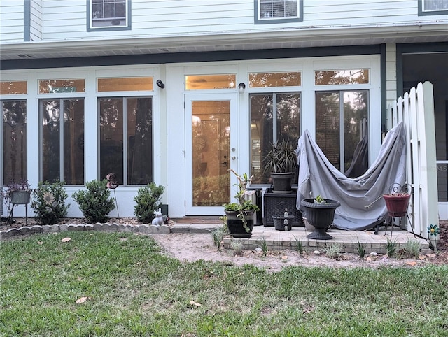 231 NE 28th Ave Unit 207, Ocala, FL 34470 - doorway to property with a lawn