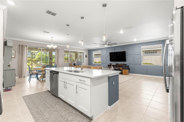 9203 SW 97th Cir, Ocala, FL 34481 - kitchen featuring a sink, ornamental molding, stainless steel appliances, light tile patterned floors, and white cabinets