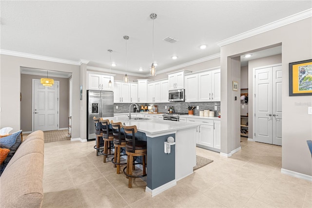 9203 SW 97th Cir, Ocala, FL 34481 - kitchen featuring stainless steel appliances, a sink, light tile patterned flooring, light countertops, and recessed lighting