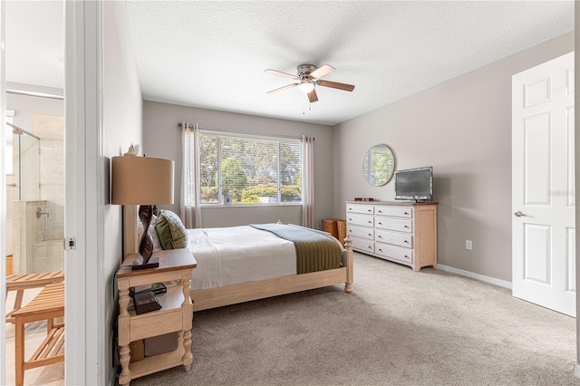 9203 SW 97th Cir, Ocala, FL 34481 - bedroom featuring light colored carpet, ensuite bathroom, a ceiling fan, and a textured ceiling